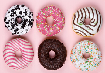 Sticker - donuts with colored glaze on a pink background