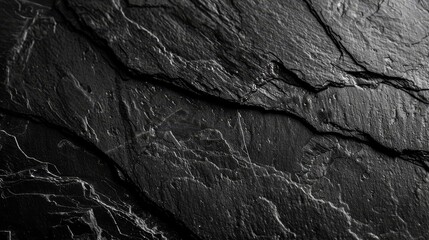 Black marble background wallpaper banner with a rough marble texture.