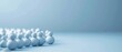 © Napat.T - A group of snowmen are lined up on a blue background