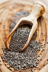 Sticker - A wooden spoon is sitting on a wooden table with a pile of black seeds