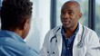 © AlfaSmart - A patient talking to a doctor in an examination room