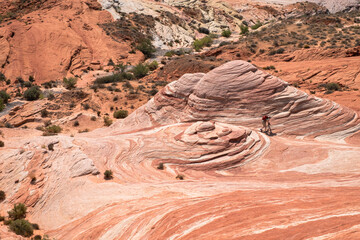 A rocky hillside with a person riding a bike