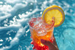 © vejaa - Woman hand holding glass of fresh cold drink on pool water background. Refreshing drink lemonade in hot summer day. Summer, vacation, holiday, resort.
