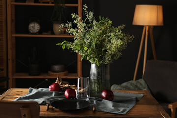 Sticker - Set of clean dishware, ripe red apples and flowers on wooden table in stylish dining room