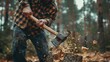 © liliyabatyrova - A man is chopping wood with an axe