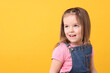 © New Africa - Portrait of cute little girl on orange background, space for text