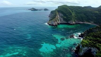 Poster - The aerial footage gives us a glimpse of the hidden coves and bays nestled within the islands surrounded by towering peaks and cliffs.