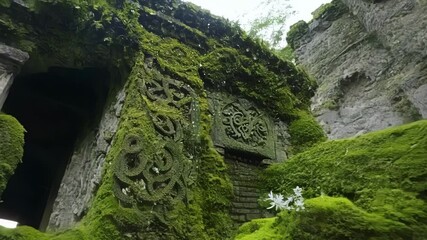 Poster - Closeup shots of intricate mosscovered ruins and intricate carvings.