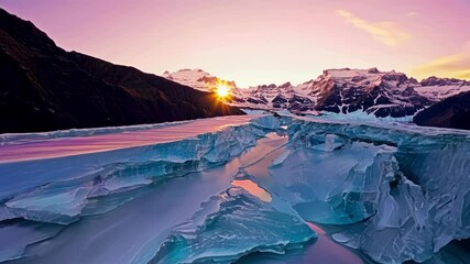 Poster - As the sun sets behind the mountains soft pastel hues paint the glacier in a dreamy ethereal light.