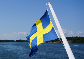 A swedish flag against the sea