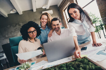 Poster - Portrait of group professional corporate workers communicate hold paper use laptop loft interior business center indoors