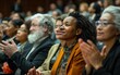 © imagineRbc - A multi-ethnic audience, seated in an amphitheater, claps their hands during a formal gathering