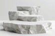 © Pooja - Product Podium - Three Asymetrical White Stone Podiums, White Background. 3D Illustration, Generative AI