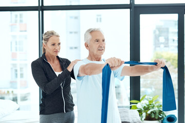 Wall Mural - Mature, woman and resistance band with physiotherapist for physical therapy, mobility exercise and arthritis management. Geriatric physiotherapy, man and stretching arm for rehabilitation and muscle.