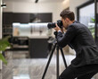 © modestil - Real Estate Photographers taking an interior photograph inside a modern clean house