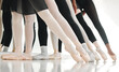 © DavisShared/peopleimages.com - People, ballet and group of feet in row for performance art, flexibility and learning of routine. Dance studio, class and legs with practice on floor in recital for talent, elegance and balance