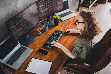 photo of attractive confident successful woman software developer sitting armchair reading site work