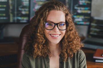 Poster - Photo of lovely pretty cheerful woman software developer sitting armchair comfortable workspace modern workstation indoors