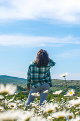 Wall Mural - Girl in a chamomile field