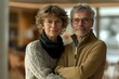 © Yuliia - Portrait of a mature couple embracing in a cozy, well-lit room. Ideal for themes of love, companionship, and lifestyle.