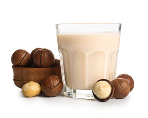 Wall Mural - Glass of fresh macadamia milk and bowl with nuts on white background