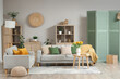 © Pixel-Shot - Interior of stylish living room with grey sofas and sunflowers on coffee table