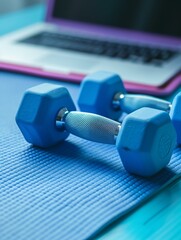 Canvas Print - A pair of dumbbells sitting on a mat next to an open laptop. AI.