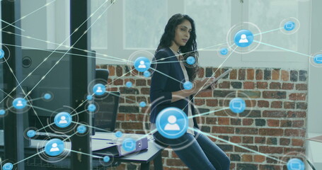 Aufkleber - Image of network of connections with icons over biracial businesswoman using tablet