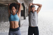 © aLListar/peopleimages.com - Serious, couple and outdoors with stretching in training for muscle, warm up and sports workout. Fitness, start and people with thinking in exercise for healthy body, flexibility and preparation