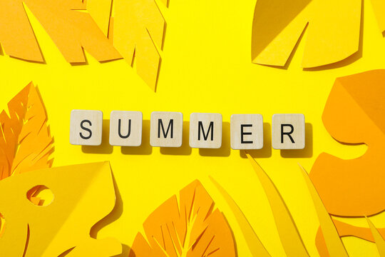 Summer, the word laid out from letters on a yellow background.