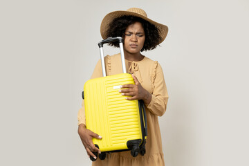 Sticker - Young African American woman in a hat with a suitcase