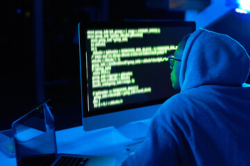 Fototapete - Code, man or hacker with computer or screen for cybercrime, malware or phishing for stealing online data. Programmer, dark or software update on pc with hacking expert for theft on website in night