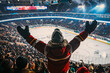 © Di Studio - back view of fan with hands up watching ice hockey game and celebrating goal at the large stadium