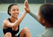 © KayJoint/peopleimages.com - Women, fitness and friends high five on court or outdoor training in park for workout, exercise or practice. Break, happy and people with support or health in celebration of challenge or performance
