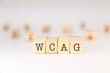 © PH alex aviles - WCAG acronym - Concept of Web Content Accessibility Guidelines written on wooden cubes isolated on white background with copy space for text phrase.