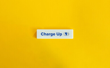 Wall Mural - Charge Up Verb and Charging Battery Icon. Energize, Excite, Stimulate, Revitalize, Invigorate, Boost, Rejuvenate, Motivate