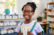 © Rido - Cute african american girl wearing eyeglasses at elemetary school