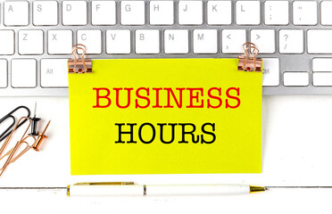 Wall Mural - BUSINESS HOURS text on yellow sticky on keyboard