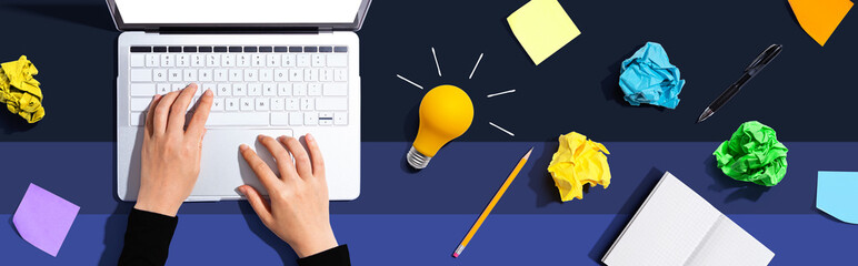Poster - Laptop Computer with a light bulb from above