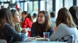 © klss777 - Students gather in the busy cafeteria, sharing laughter and engaging discussions over lunch.
