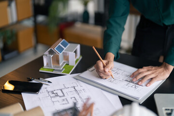 Fototapete - Interior architect or engineer working on blueprint