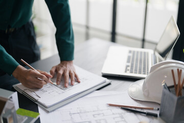 Fototapete - Interior architect or engineer working on blueprint