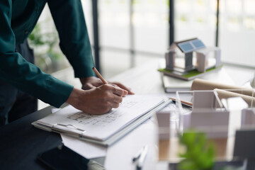 Fototapete - Interior architect or engineer working on blueprint