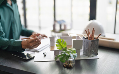 Fototapete - Interior architect or engineer working on blueprint
