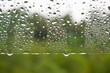 © JeromeMaurice - Straight view of water droplets on clear glass after rainy day