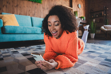 Sticker - Photo of excited cheerful lady wear orange sweater having rest communicating modern gadget indoors room home house