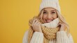 © Alona - Winter Accessories. Happy Young Woman in White Knitted Sweater, Scarf and Hat on Yellow Background
