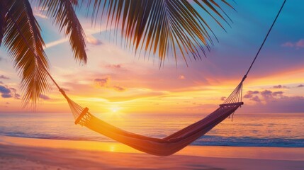 Wall Mural - Sunset on a tropical beach with palm trees and a hammock, serene and relaxing vacation scene.