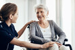 © ReeseArcurs/peopleimages.com - Help, nurse and senior woman in wheelchair for assistance, support or medical care in retirement home. Discussion, friendly caregiver and elderly patient with disability for wellness, health or trust