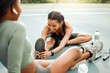 © KayJoint/peopleimages.com - Sports court, women and people with fitness, stretching and training for wellness, workout and time together. Friends, outdoor or girls with conversation, support and exercise with smile or routine